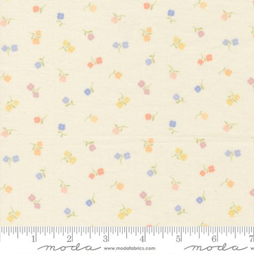 Floral pattern fabric with a ruler for scale on a beige background