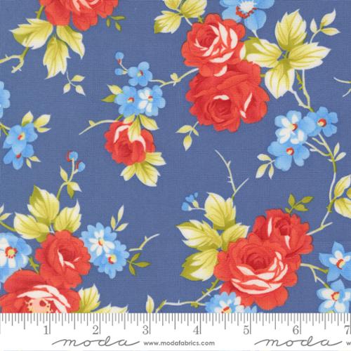 Floral fabric pattern with red roses and blue flowers on a blue background, featuring Moda label.