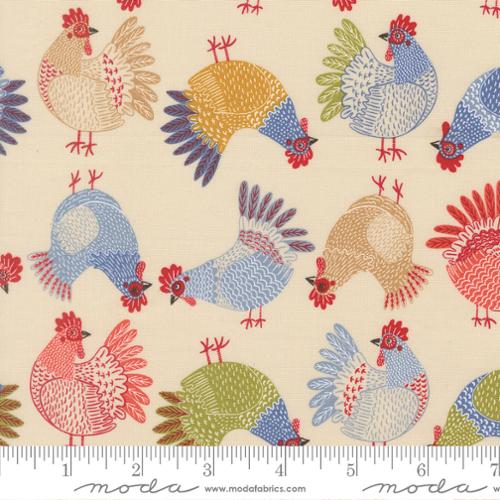 Colorful pattern of stylized chickens on fabric with a ruler for scale.