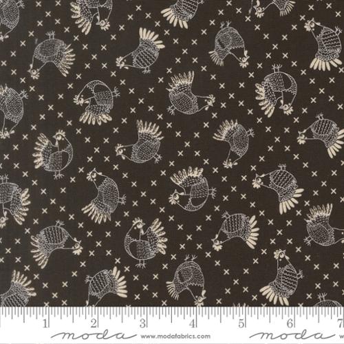 Fabric with white rooster pattern on a black background, featuring Moda label.