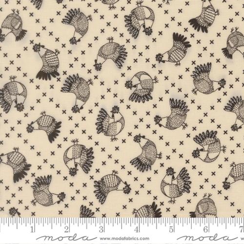 Pattern of black roosters on a beige background with Moda label.