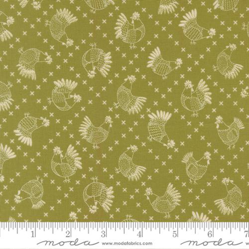 Fabric with chicken pattern on a green background, featuring Moda label.