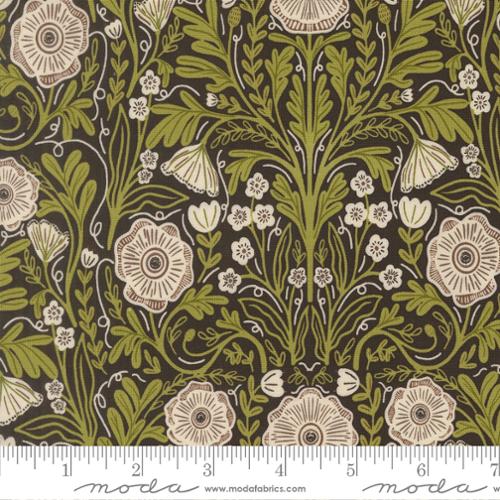 Floral pattern fabric with a ruler at the bottom, featuring green and beige flowers on a dark background.