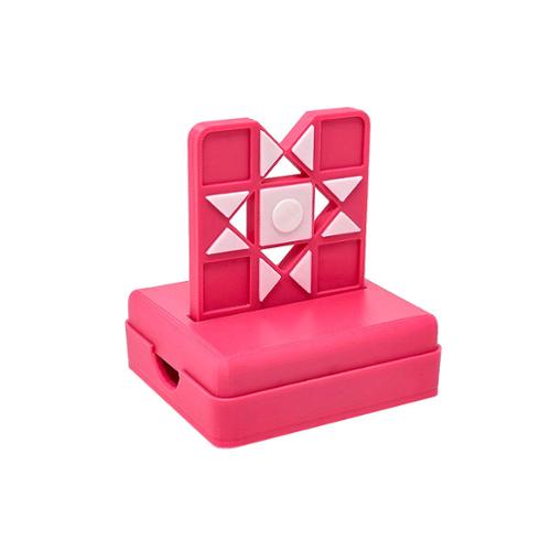 Pink geometric puzzle toy on a white background