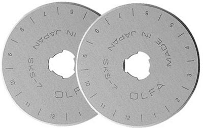 Two metal rotary cutting blades with 'OLFA' branding on a white background