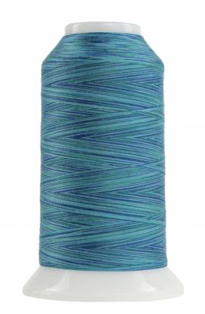 Spool of blue thread on a white background