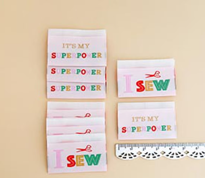 Minki Kim Superpower 2 woven labels by Riley Blake for quilts and bags