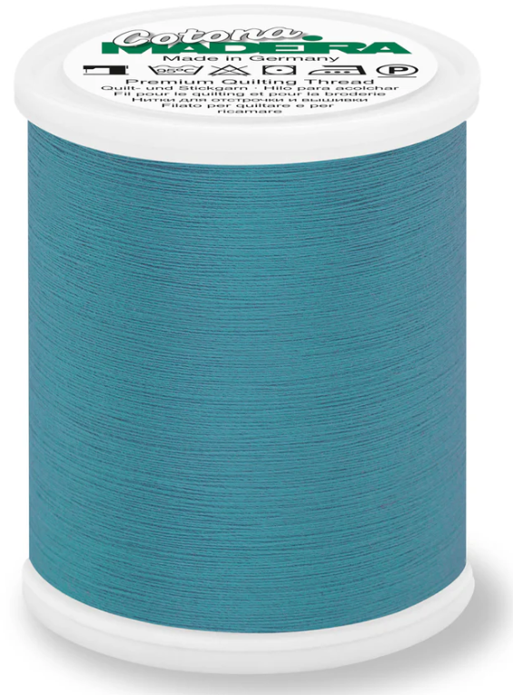 Spool of Madeira Cotona 50wt thread in Peacock Blue, color 634