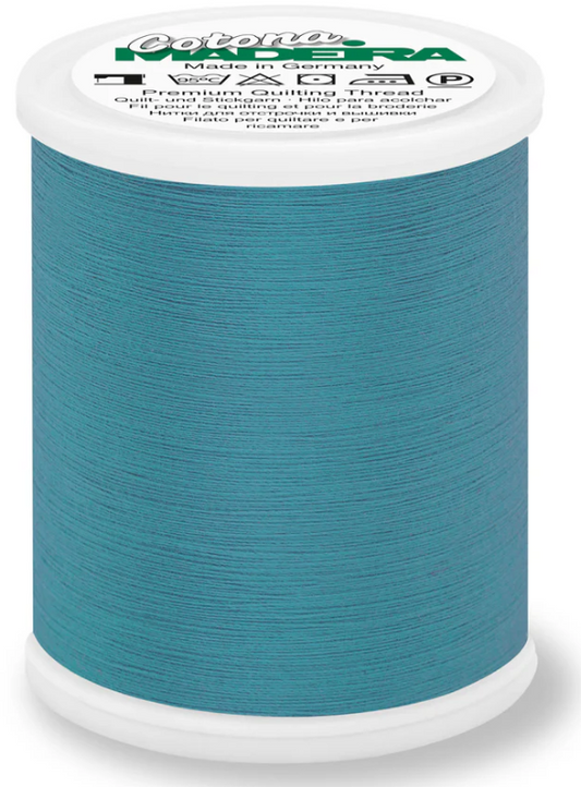 Spool of Madeira Cotona 50wt thread in Peacock Blue, color 634