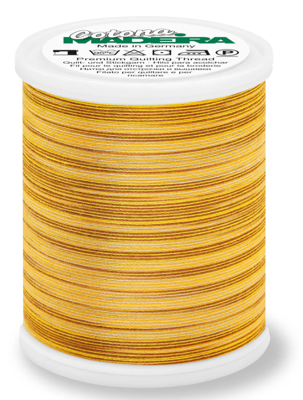 Spool of Madeira Cotona 50wt thread in Savanna, color 507