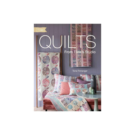 Book cover of 'Quilts from Tilda's Studio' by Tone Finnanger with quilt images on a white background.