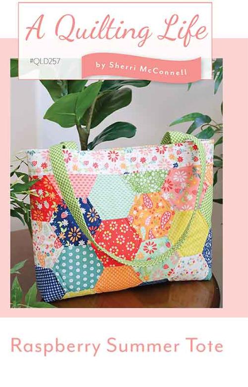 Colorful quilted tote bag with 'A Quilting Life' branding and 'Raspberry Summer Tote' text.