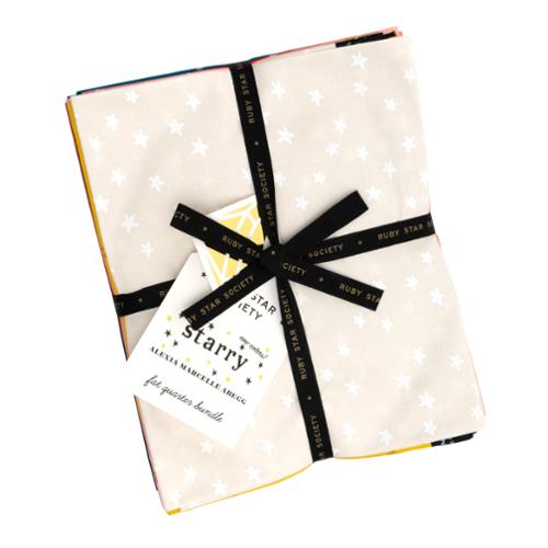 Starry patterned fabric with black ribbons on a white background