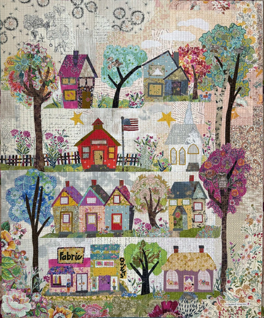Small Town Charm collage quilt pattern by Laura Heine featuring fused applique design of a nostalgic small town