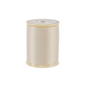 Spool of thread on a white background