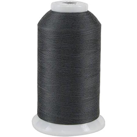 Spool of dark gray thread on a white background