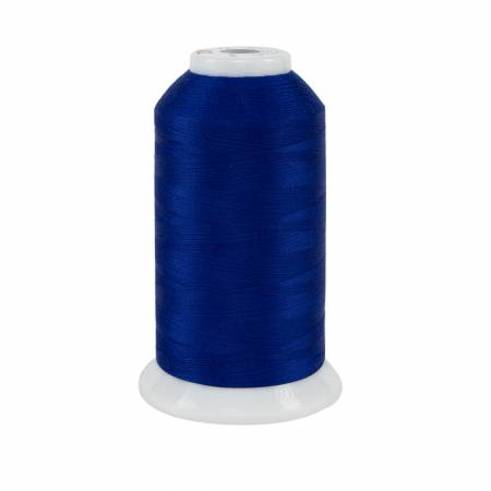 Spool of blue thread on a white background
