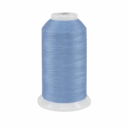 Spool of blue thread on a white background