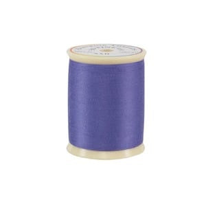 Spool of purple thread on a white background