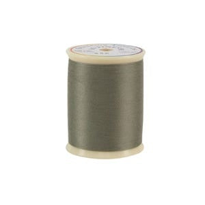 Spool of gray thread on a white background