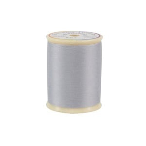 Spool of gray thread on a white background