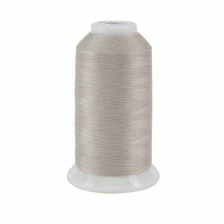 Spool of gray thread on a white background