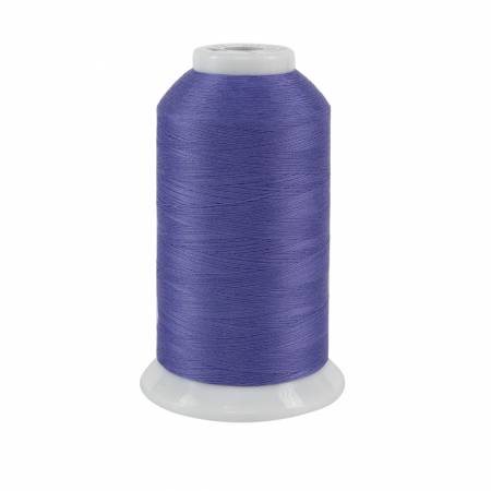 Spool of purple thread on a white background