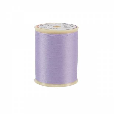 Spool of purple thread on a white background