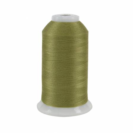 Spool of green thread on a white background
