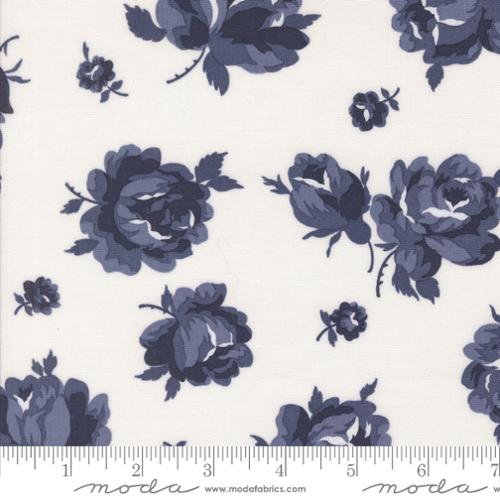 Blue floral pattern on white fabric with Moda label
