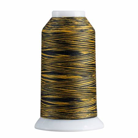 Spool of black and gold thread on a white background