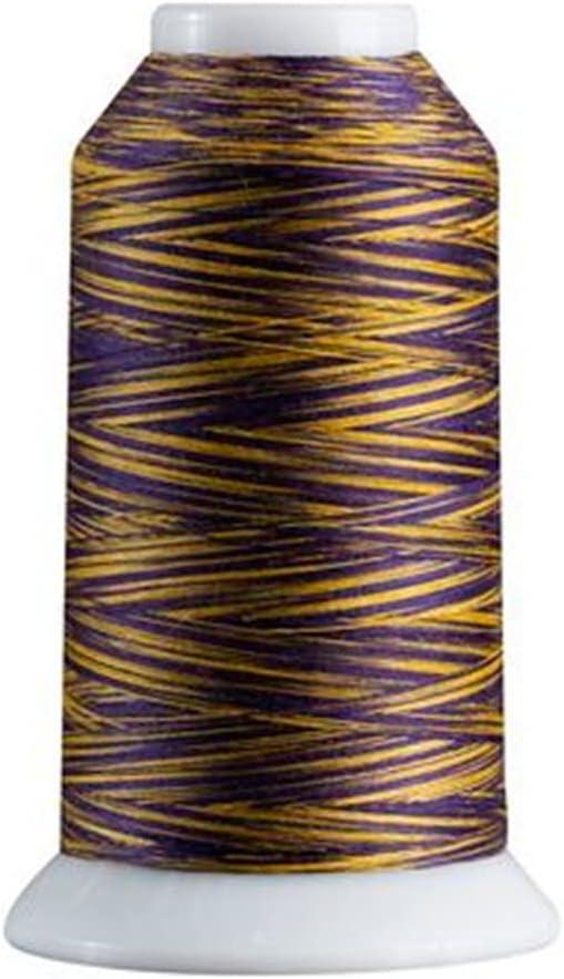 Spool of purple and gold thread on a white background