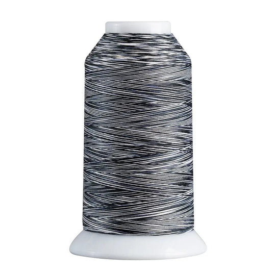 Spool of black and white thread on a white background