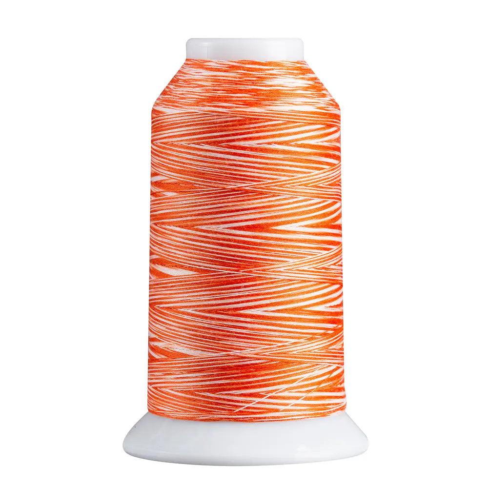 Spool of orange and white thread on a white background