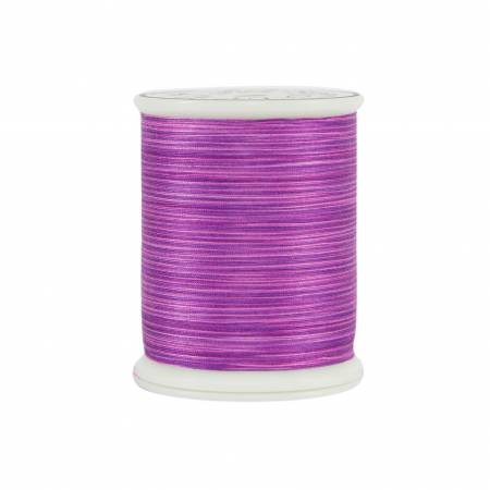 Spool of purple thread on a white background