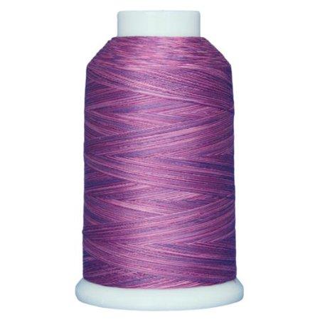 Spool of purple thread on a white background