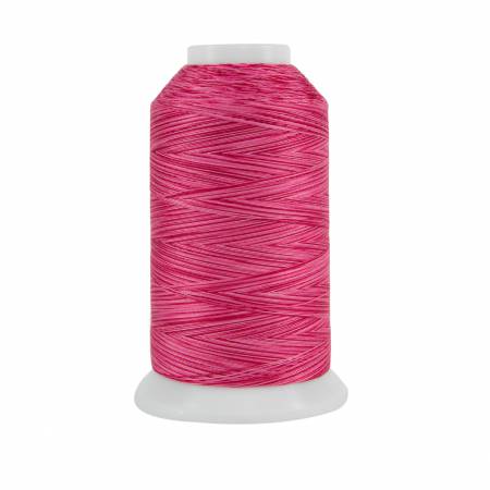 Spool of pink thread on a white background