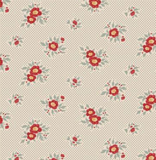Cream background with tiny blue dots and scattered red floral bouquets with blue-green leaves.