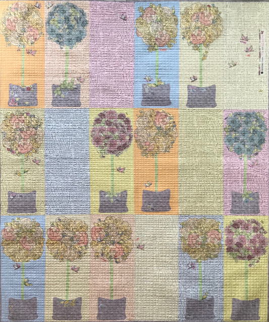 Topiary collage quilt pattern by Laura Heine featuring vibrant Potpourri fabric design and optional wall hanging pattern