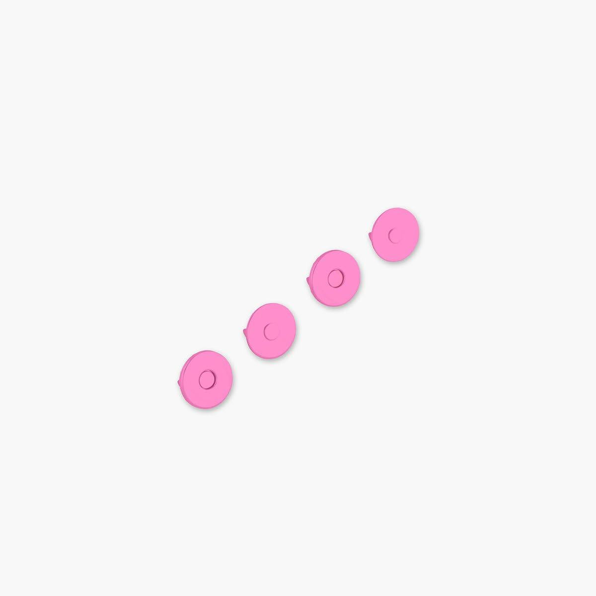 Five pink circular objects on a white background