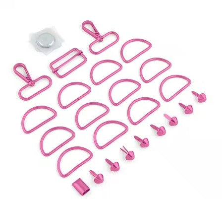 Set of pink plastic parts on a white background