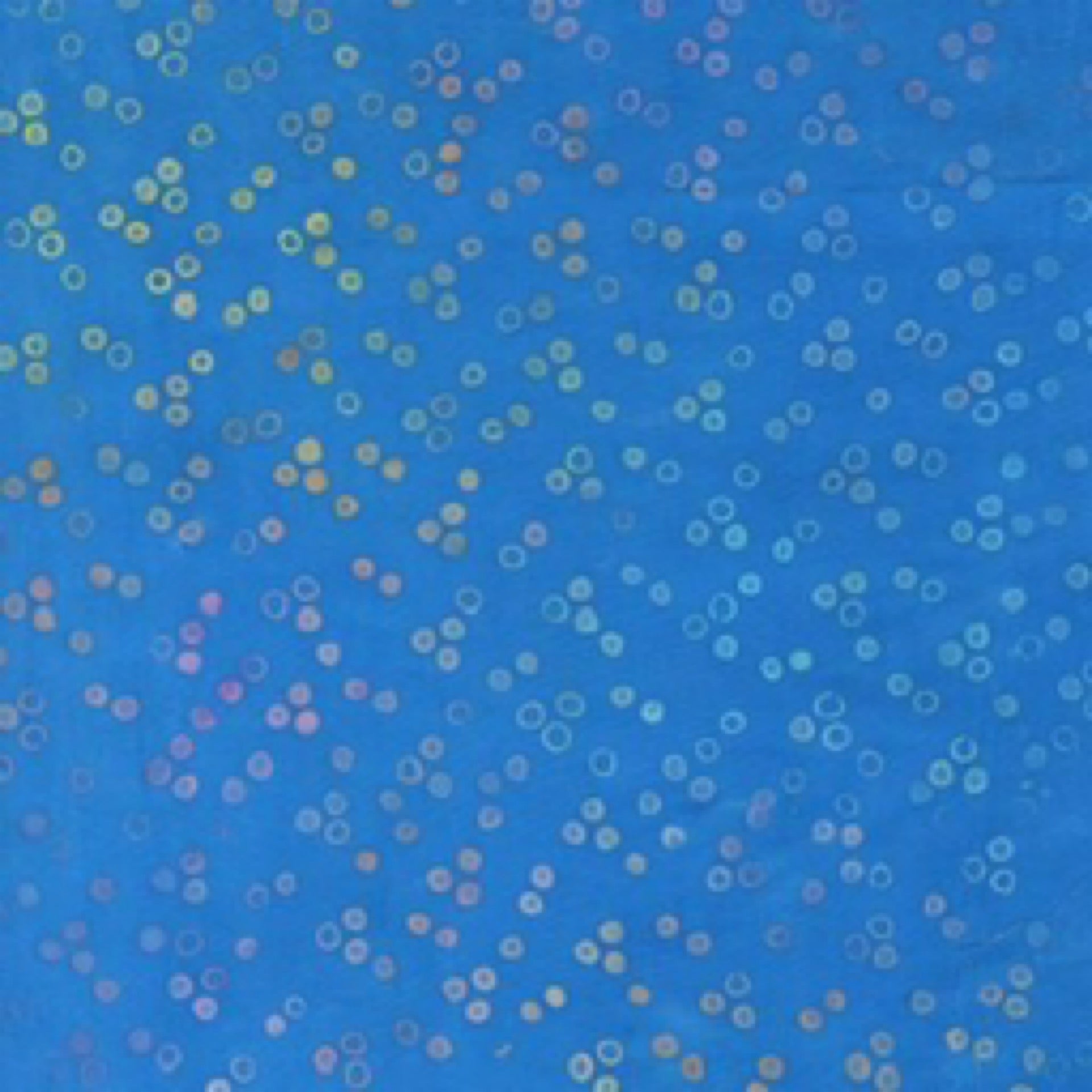Blue fabric with small multicolored circles pattern