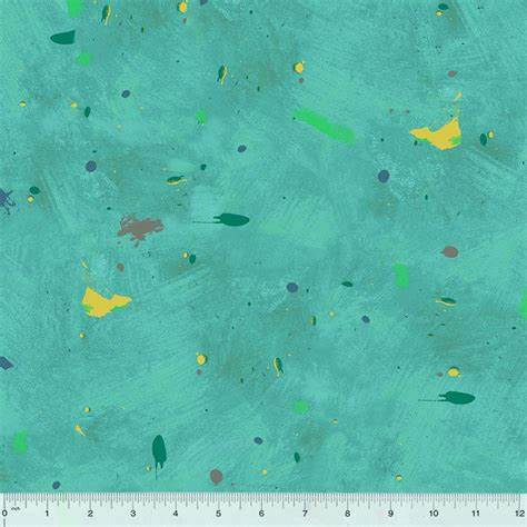 Turquoise fabric with colorful abstract patterns and a ruler at the bottom for scale.